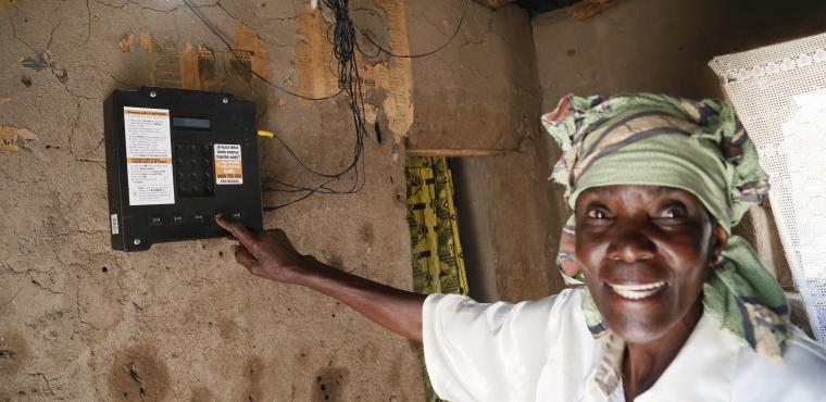 Tanzania woman points at meter